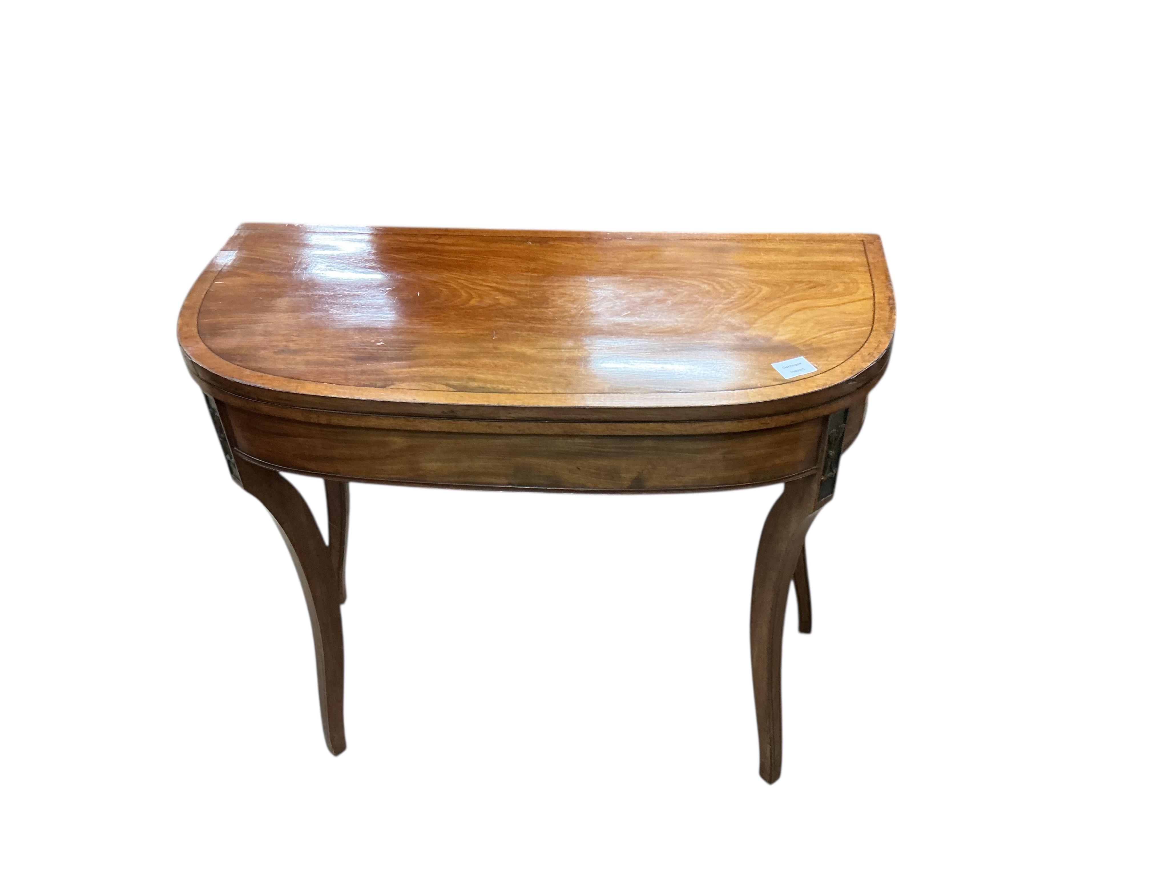 A Regency mahogany D shaped folding card table, width 92cm, depth 45cm, height 74cm